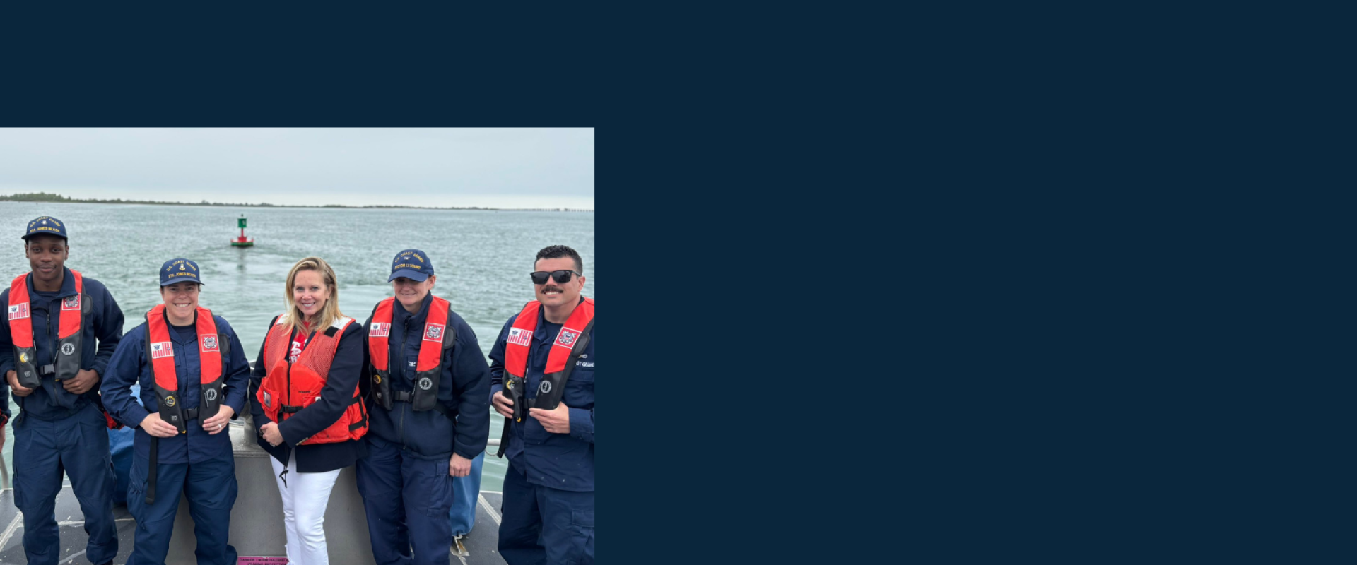 Gillen with Coast Guardsmen at Jones Beach. 